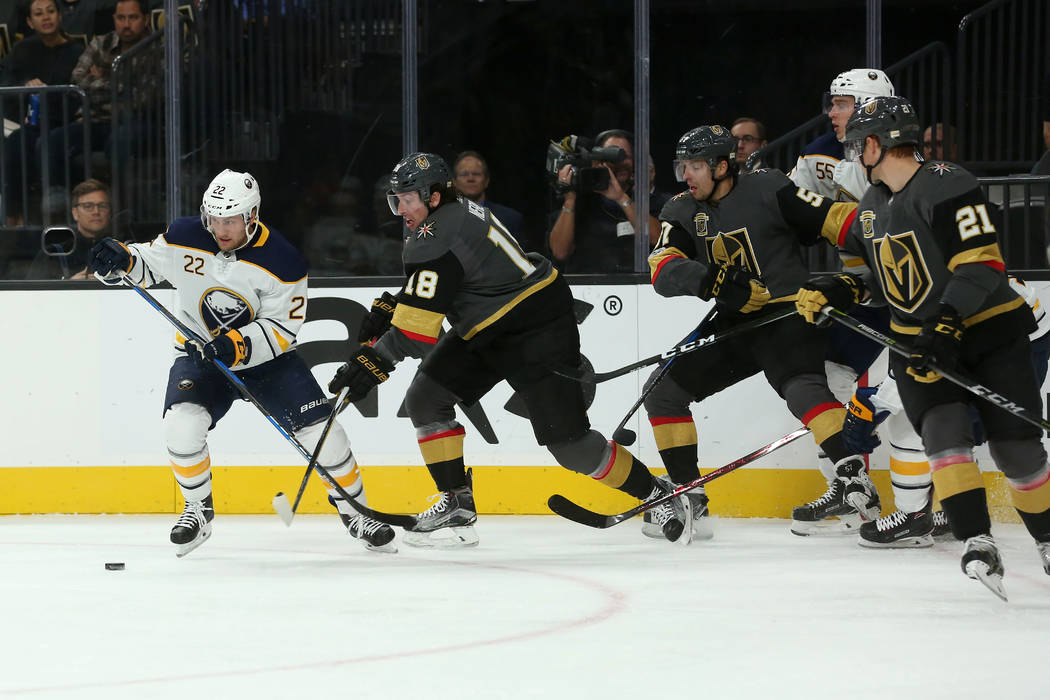 Buffalo Sabres center Johan Larsson (22) bring the puck up the ice while Vegas Golden Knights players trail behind him during a game at T-Mobile Arena in Las Vegas, Tuesday, Oct. 17, 2017. Bridget ...