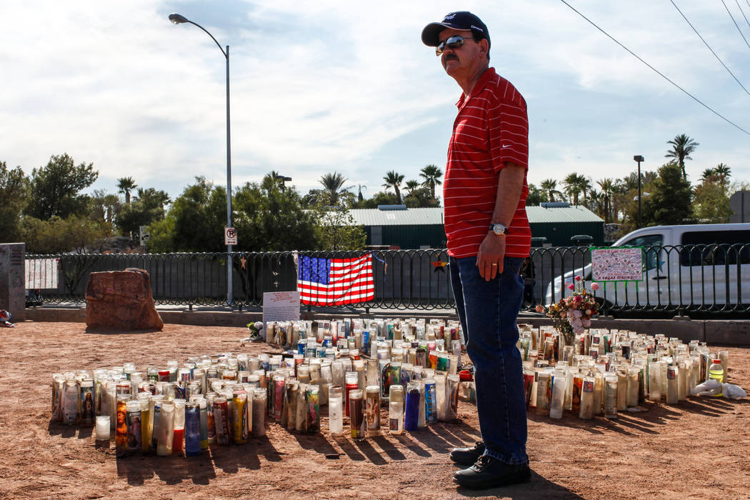 Dave Madden of Canada, 61, visits a memorial at the Welcome to Fabulous Las Vegas sign in Las Vegas, Monday, Oct. 16, 2017, honoring the victims of the Route 91 Harvest Festival mass shooting. Joe ...