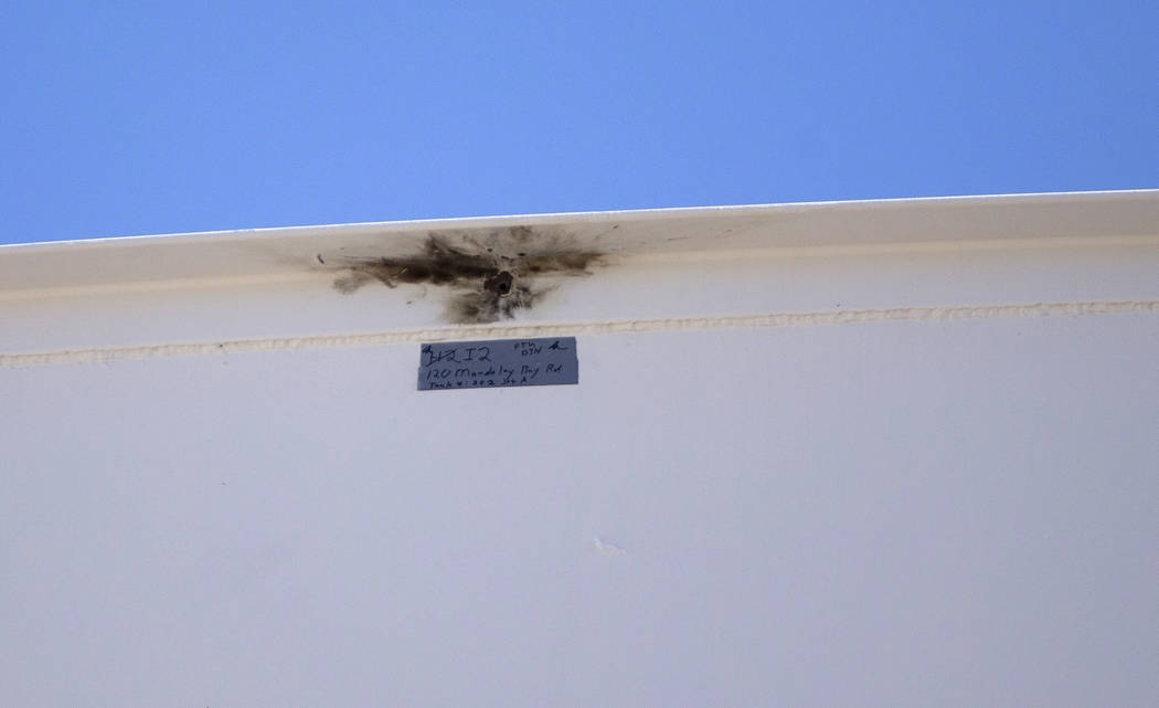 A bullet hole marked as evidence on a fuel tank near the site of the Route 91 Harvest country music festival in Las Vegas on Thursday, Oct. 19, 2017. The tank was struck by gunfire, October 1, 201 ...