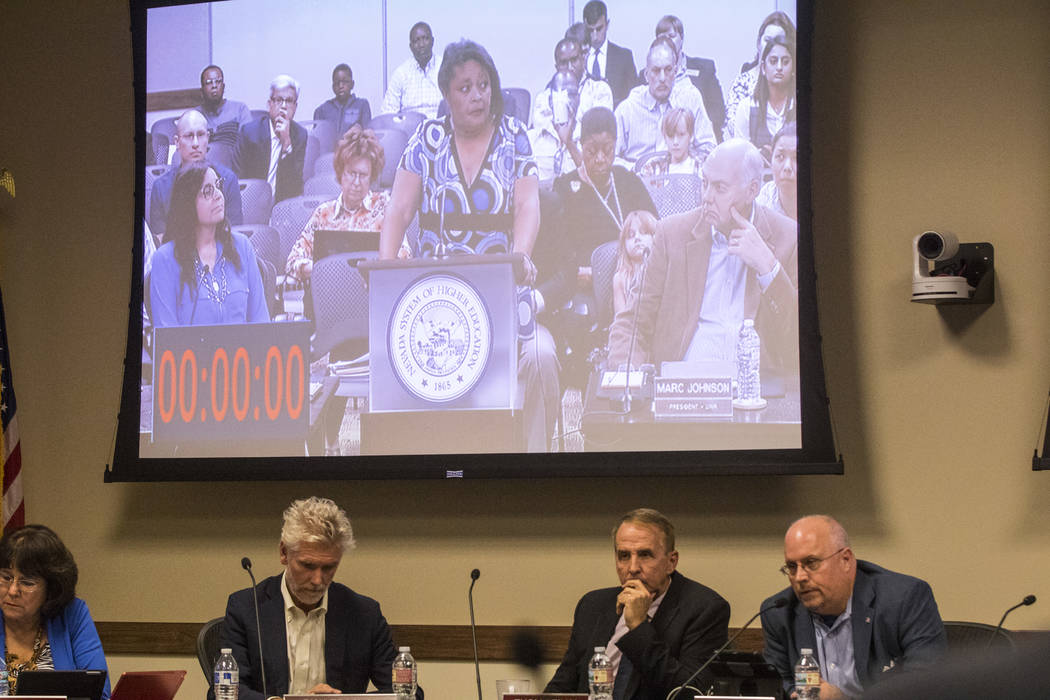 Simona Johnson, mother of a daughter with HIV, shown on the screen, speaks during public comment at a meeting of the Nevada Board of Regents at the Nevada System of Higher Education administration ...