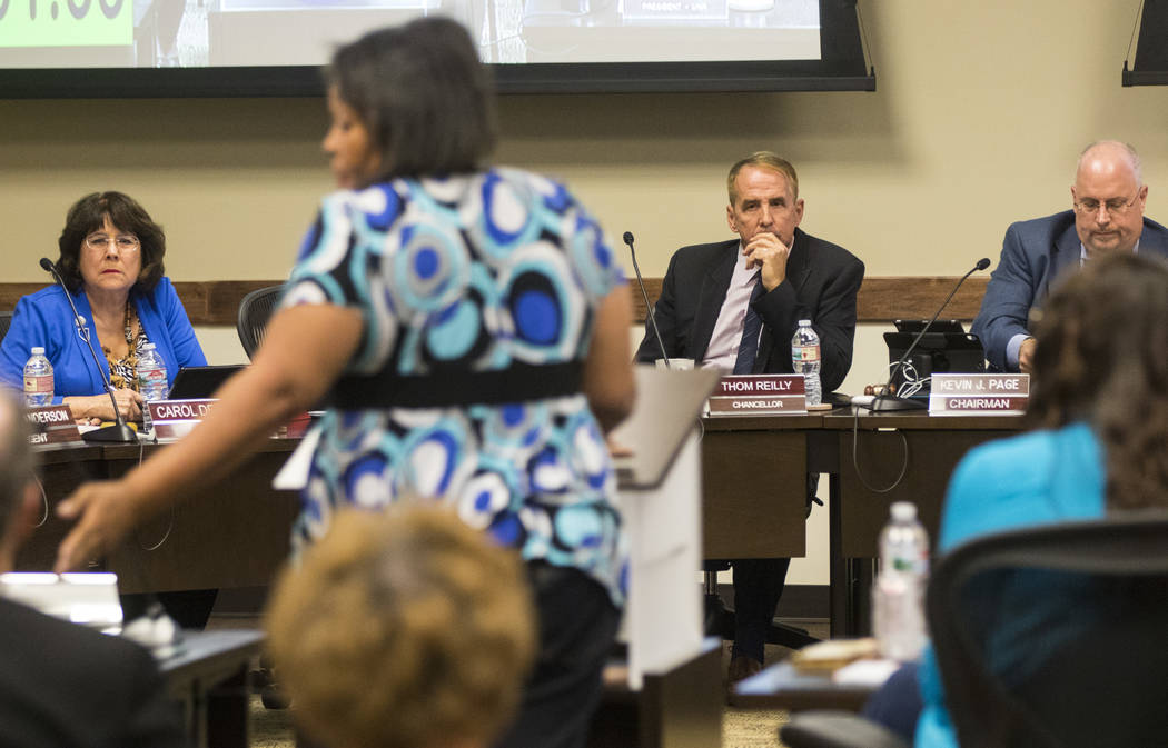 Simona Johnson, mother of a daughter with HIV, second from left, speaks during public comment at a meeting of the Nevada Board of Regents at the Nevada System of Higher Education administration of ...
