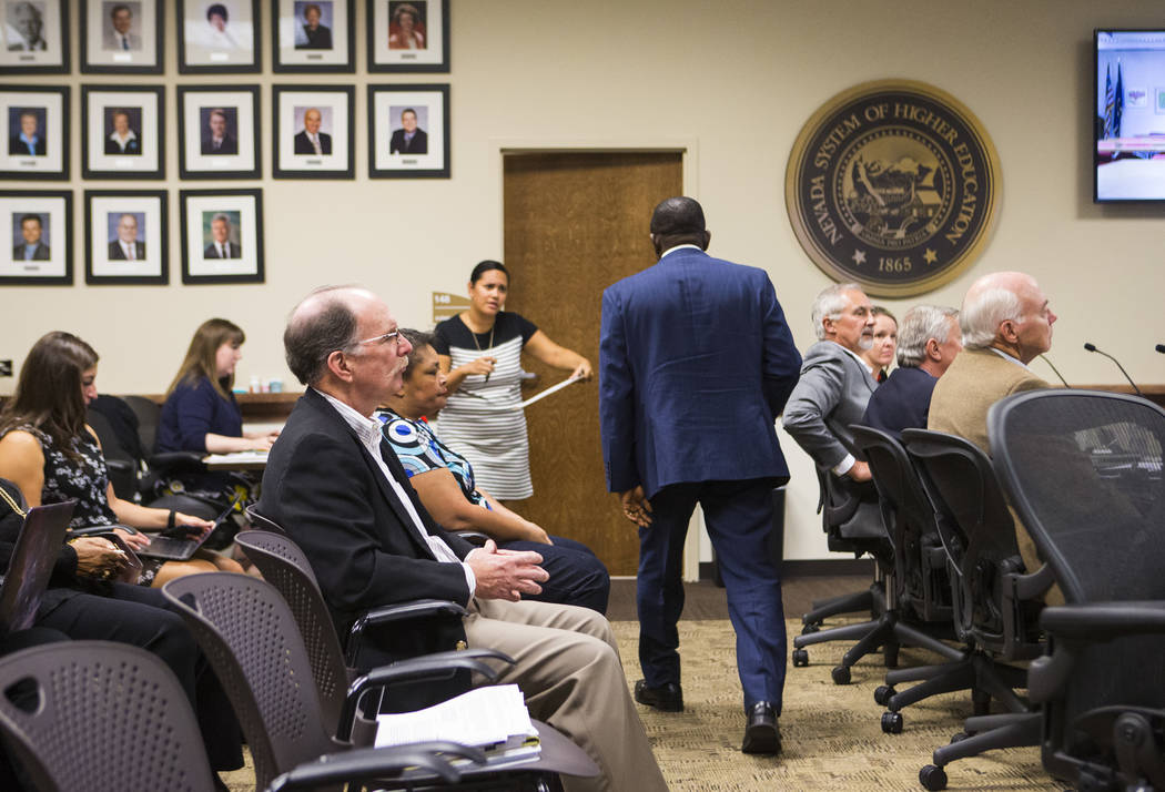 Professor Echezona Ezeanolue, who directs the pediatric HIV program at UNLV's School of Community Health Sciences, right, after speaking during public comment at a meeting of the Nevada Board of R ...