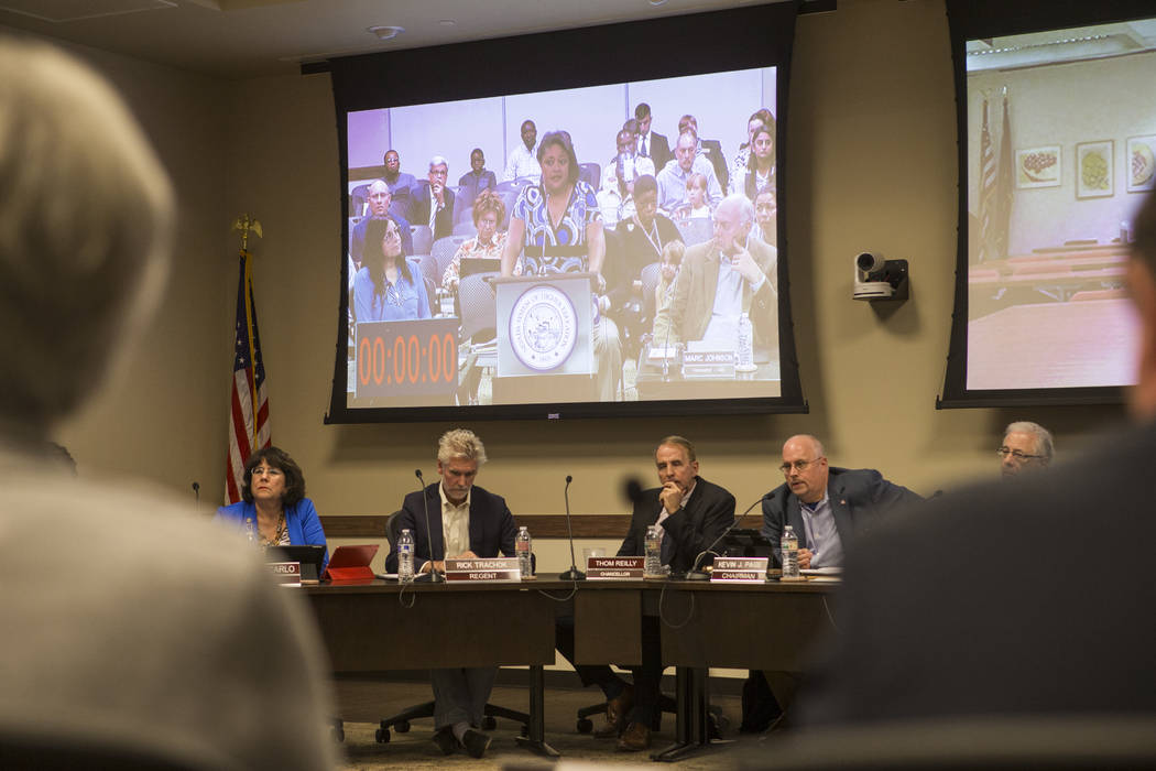 Simona Johnson, mother of a daughter with HIV, shown on the screen, speaks during public comment at a meeting of the Nevada Board of Regents at the Nevada System of Higher Education administration ...