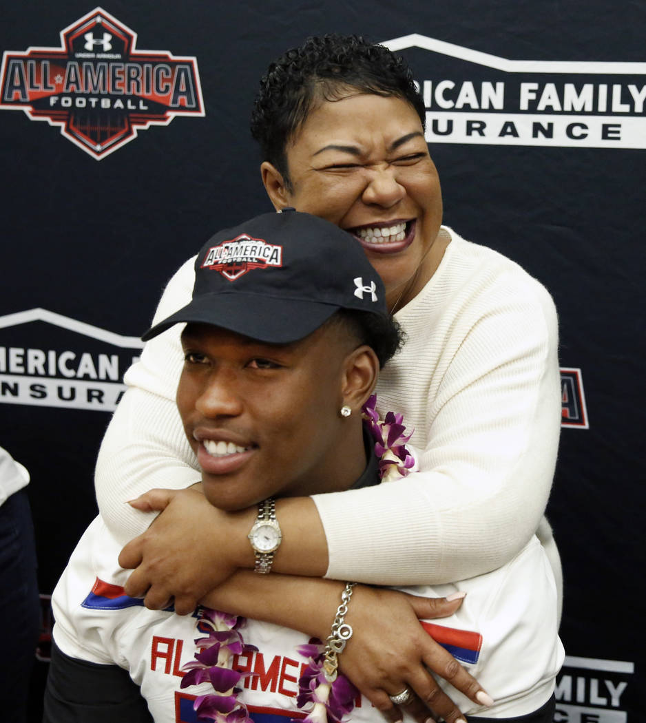Bishop Gorman's tight end Brevin Jordan, with his mother Beverley after receiving his honorary All America Game jersey at his school Wednesday, Oct. 25, 2017, in Las Vegas. Bizuayehu Tesfaye Las V ...