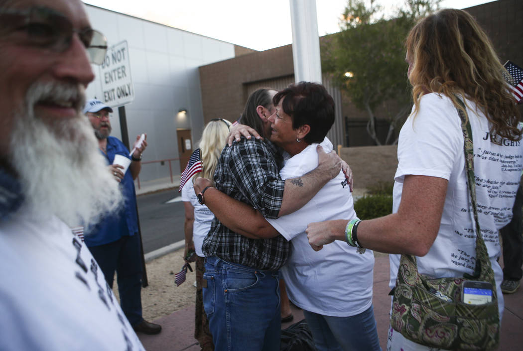 Scott Drexler, center left, is embraced by Margaret Houston, sister of Cliven Bundy, after he and three other defendants in the Bunkerville standoff case were released at the Henderson Detention C ...