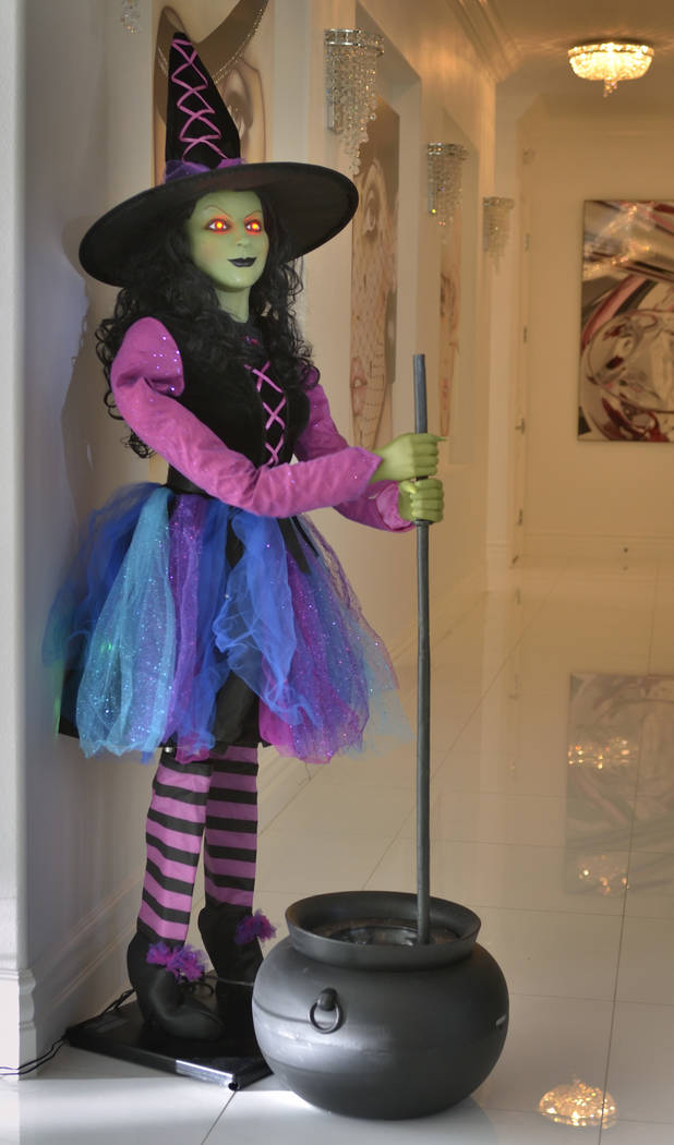 An electronic witch greets guests in a hallway. (Bill Hughes Real Estate Millions)
