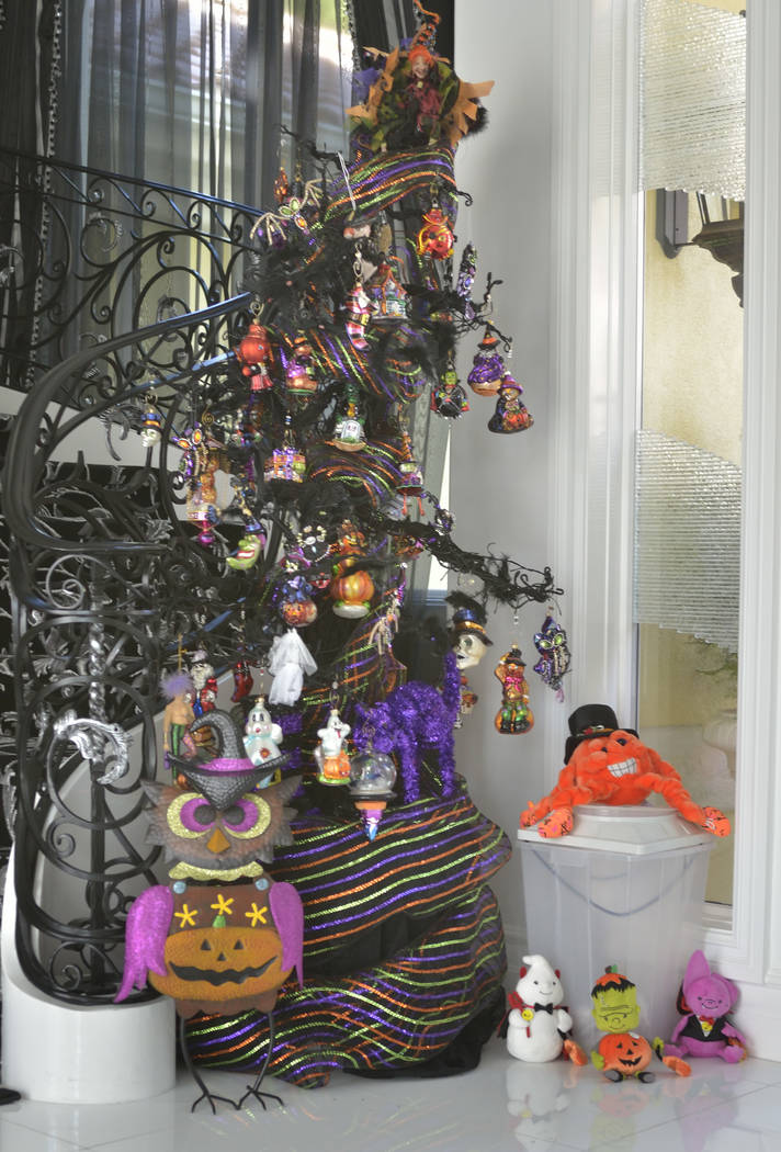A Halloween tree greets visitors at the home's staircase. (Bill Hughes Real Estate Millions)