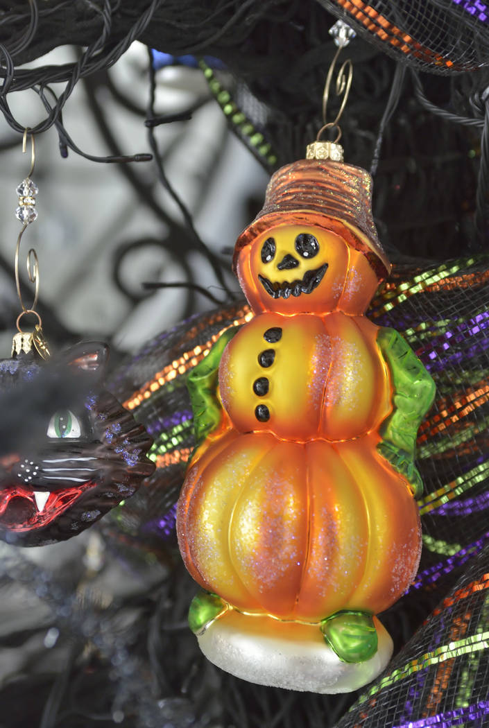A Halloween tree holds lots of detailed decorations. (Bill Hughes Real Estate Millions)