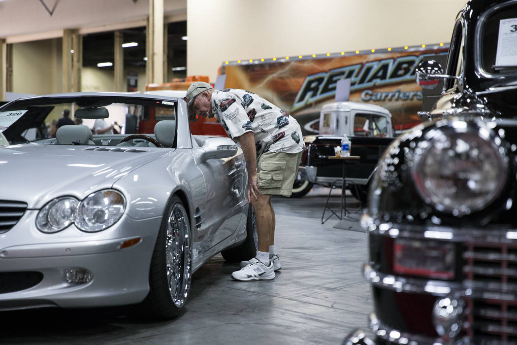 Jim Berger of Las Vegas looks at a 2003 Mercedes-Bens SL500 during the Barrett-Jackson car auction at the Mandalay Bay Convention Center in Las Vegas, Friday, Oct. 20, 2017. Erik Verduzco Las Vega ...