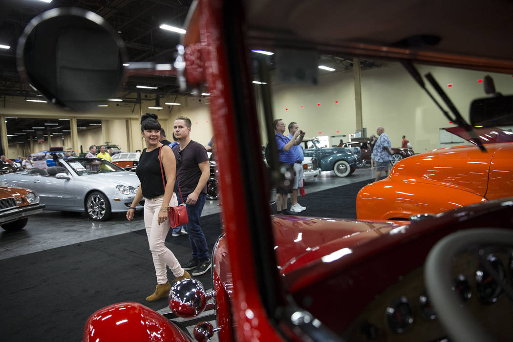 Hannah Prothero, left, and her husband Loren browse the showroom floor of the Barrett-Jackson car auction at the Mandalay Bay Convention Center in Las Vegas, Friday, Oct. 20, 2017. Erik Verduzco L ...