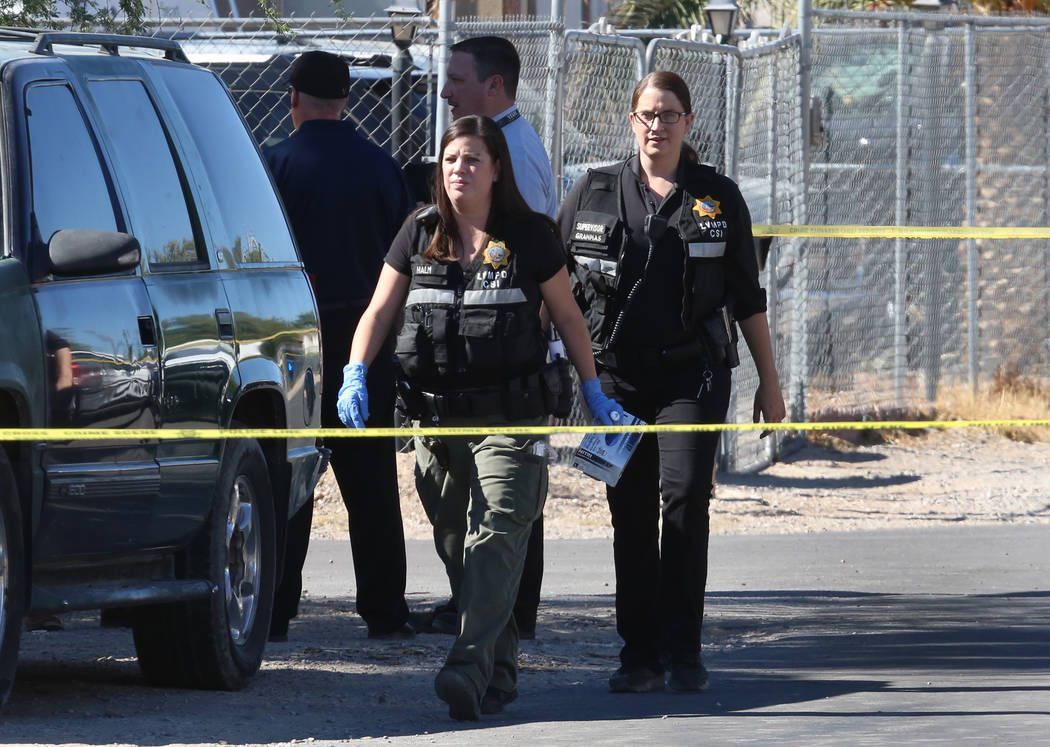 Las Vegas police investigate a homicide at a vacant home in the 5800 block of East Carey Avenue, near North Nellis and East Lake Mead boulevards, on Monday, Oct. 23, 2017. (Bizuayehu Tesfaye/Las V ...