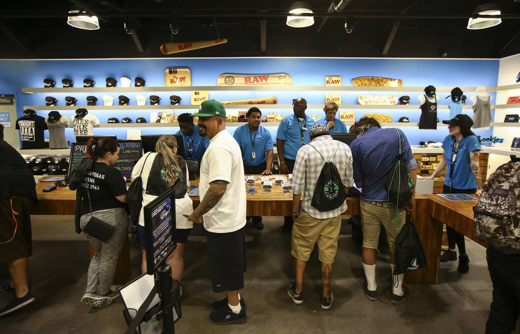 Customers line up to be some of the first people to legally purchase recreational marijuana from a dispensary at Reef Dispensaries in Las Vegas on Saturday, July 1, 2017. Chase Stevens Las Vegas R ...