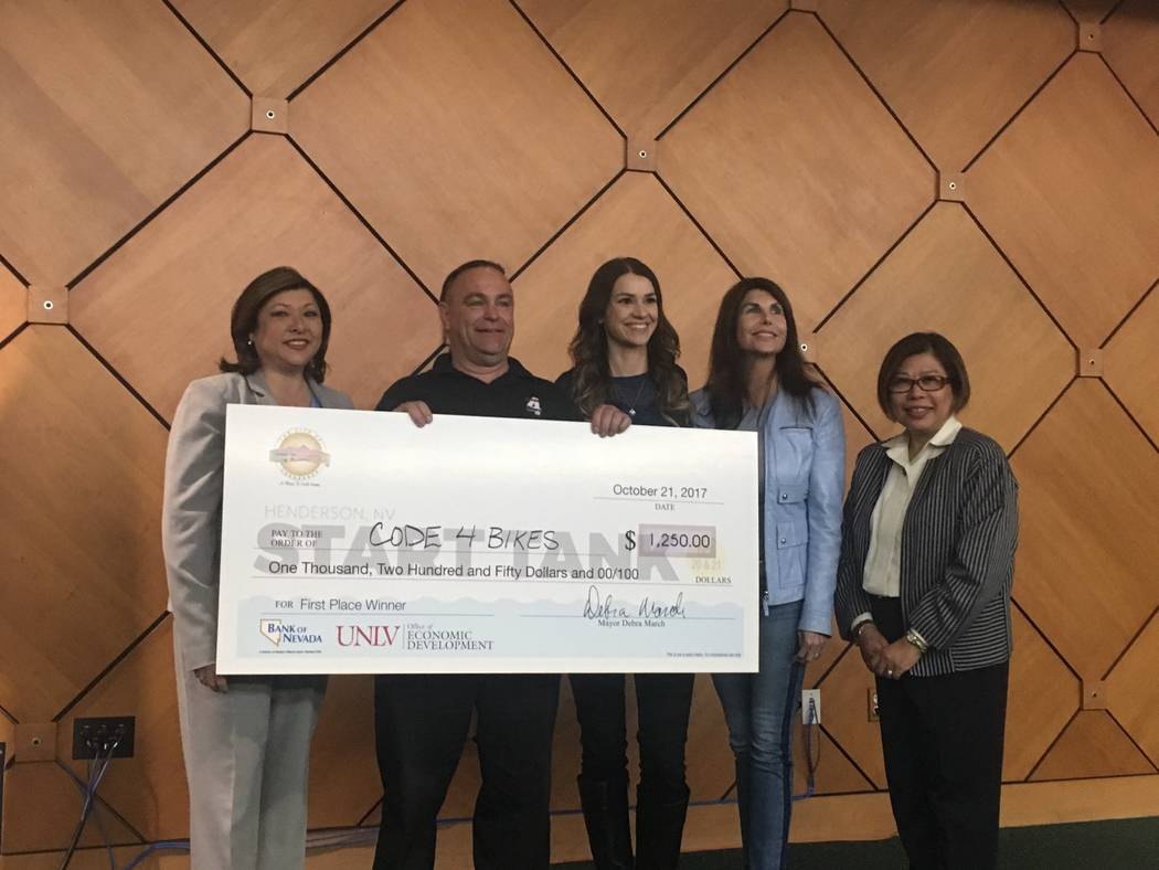 Start Tank winner Brett Marshall stands next to Henderson city councilwoman Gerri Shroder, and judges Liz Lewis, Kelly Brockman and Violeta Alcantara as he holds his grand prize check for $1,250 t ...