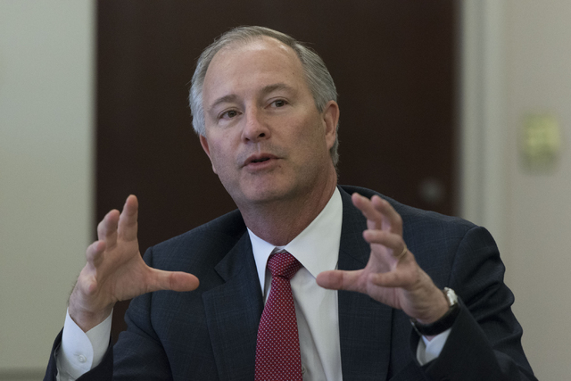 Steve Hill, executive director with the Governor's Office of Economic Development, speaks with Gov. Brian Sandoval in Carson City via teleconference during a board meeting at the Governor's Office ...
