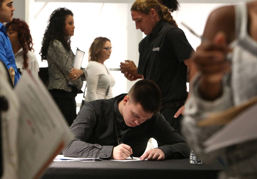 Josh Pullman fills out his job application form during the Nevada Day Super Hiring Event on Wednesday, Oct. 25, 2017 at the Boulevard Mall in Las Vegas. Bizuayehu Tesfaye Las Vegas Review-Journal  ...