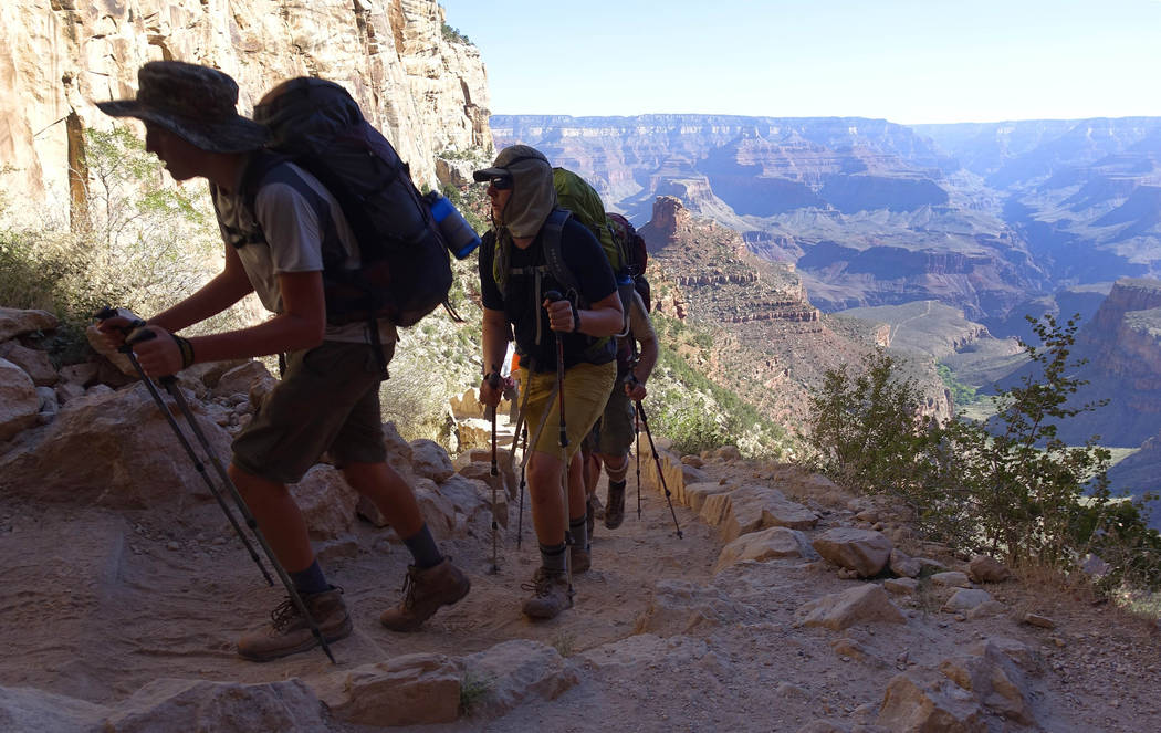 FILE - In this July 27, 2015, file photo, a long line of hikers head out of the Grand Canyon along the Bright Angel Trail at Grand Canyon National Park, Ariz. The National Park Service is floating ...