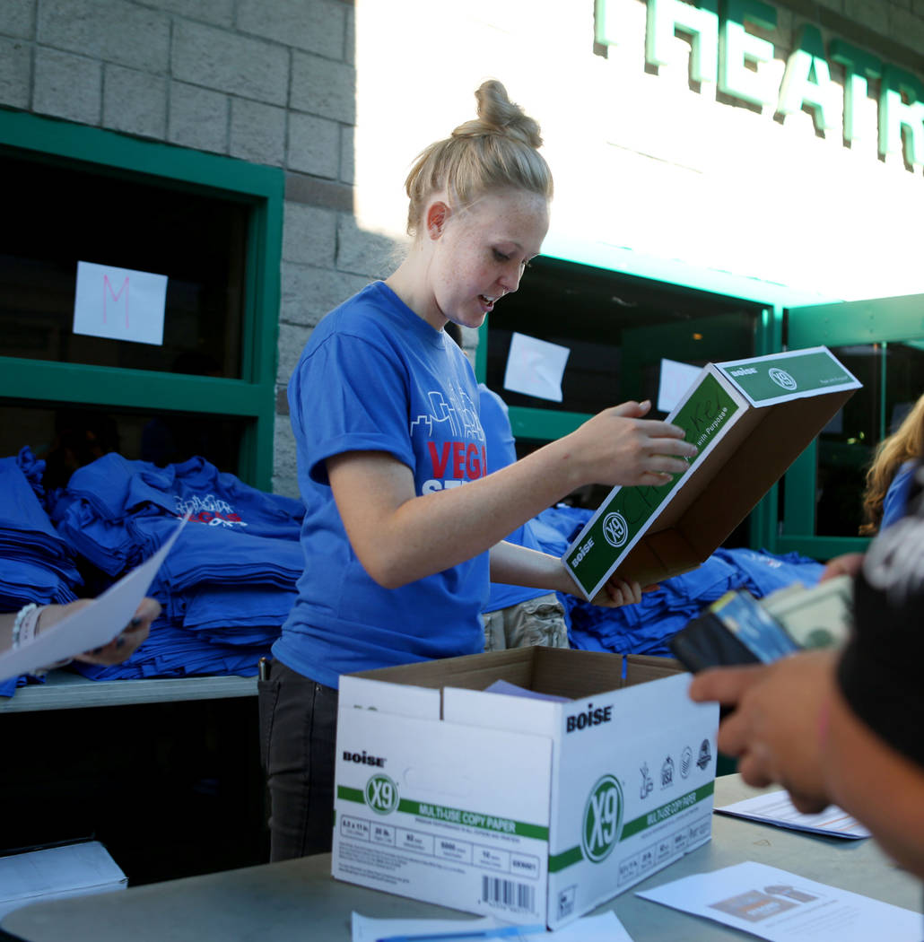 Green Valley High School senior Maddie Jensen, 17, distributes Vegas Strong T-shirts at Green Valley High School in Henderson, Wednesday, Oct. 25, 2017. (Elizabeth Brumley/Las Vegas Review-Journal ...