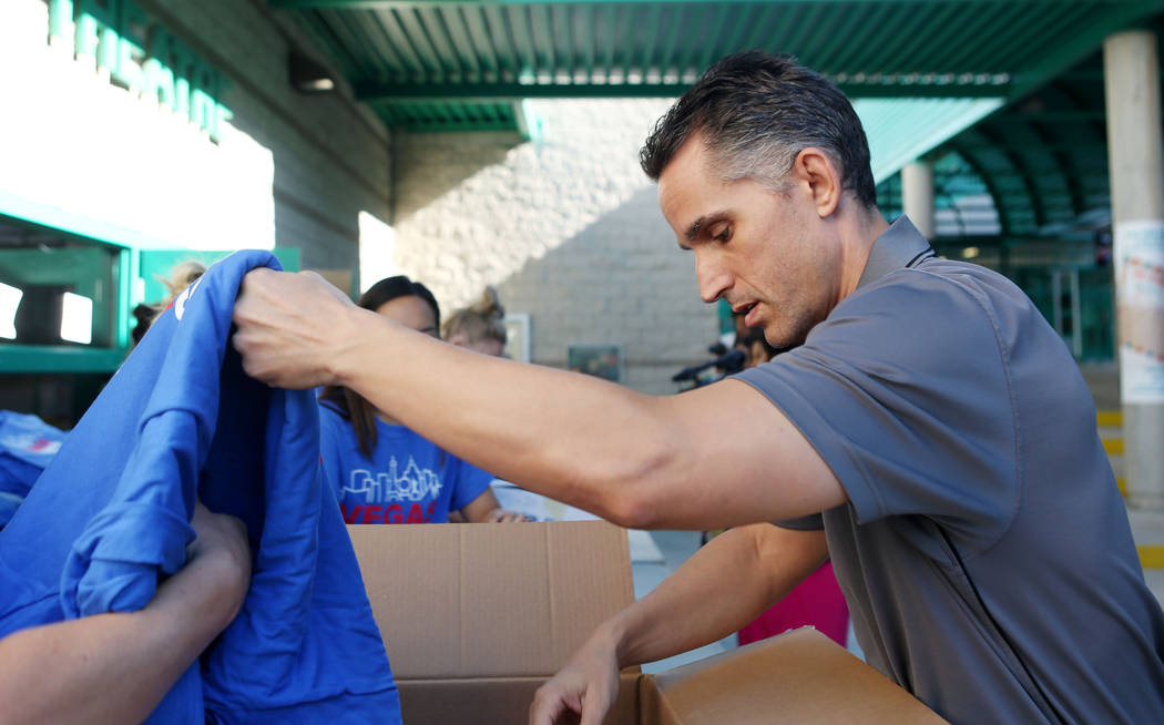 Demetrius Johnston, principal of Johnston Middle School, double-checks his order of Las Vegas Strong T-shirts at Green Valley High School in Las Vegas, Wednesday, Oct. 25, 2017. More than 130 scho ...
