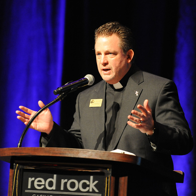 Deacon Tom Roberts, president and chief operation officer of Catholic Charities of Southern Nevada makes opening comments at the 73rd anniversary celebration Heart of Hope awards ceremony at the R ...