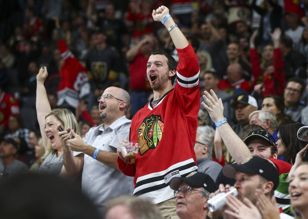 A Chicago Blackhawks fan celebrates a goal against the Golden Knights during an NHL hockey game at T-Mobile Arena in Las Vegas on Tuesday, Oct. 24, 2017. Chase Stevens Las Vegas Review-Journal @cs ...