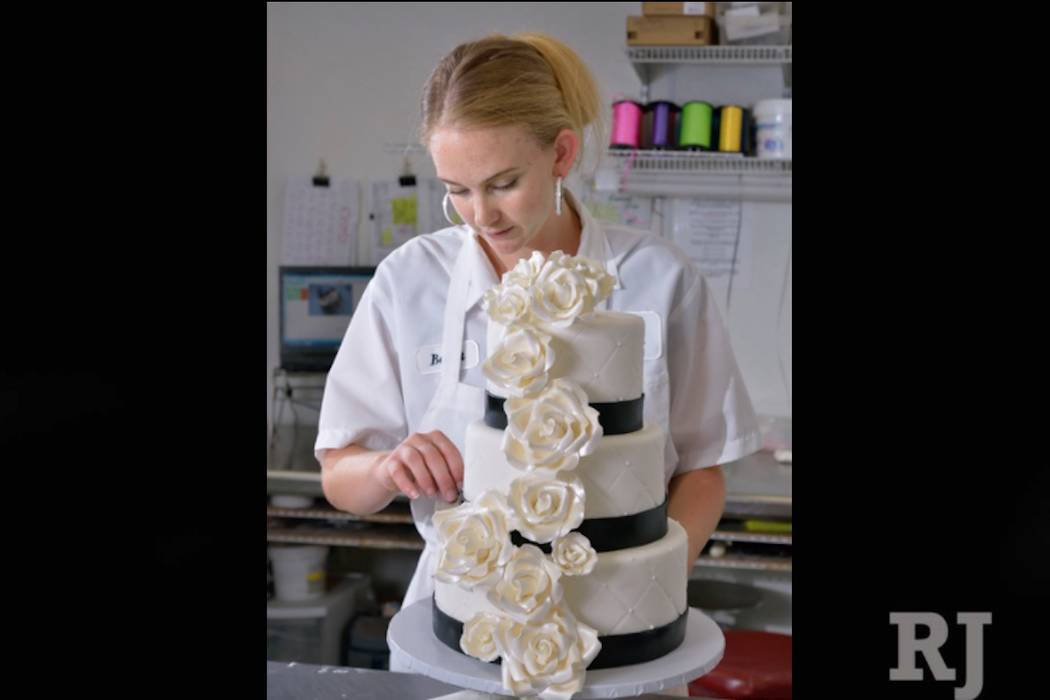 Barret Carpenter works on a wedding cake at Freed's Bakery in Las Vegas on Thursday, July 3, 2014. (Bill Hughes/Las Vegas Review-Journal)