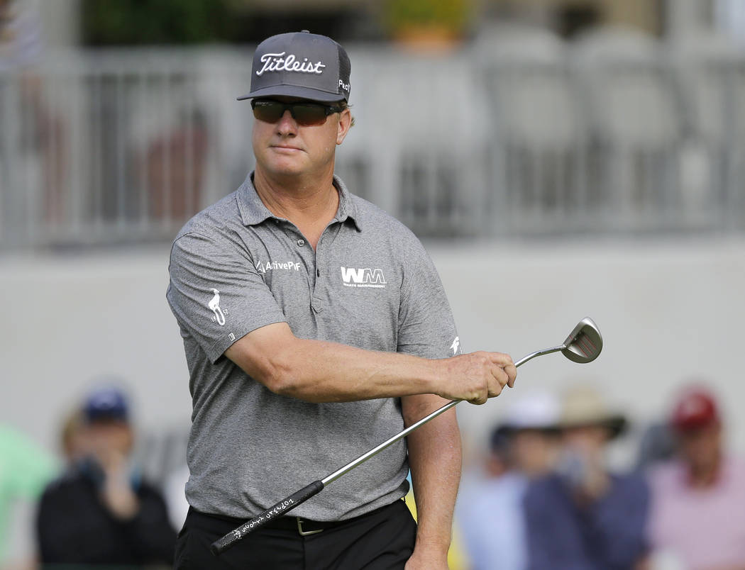Charley Hoffman gestures left as he watches his putt on the 18th hole during the third round of the Bridgestone Invitational golf tournament at Firestone Country Club, Saturday, Aug. 5, 2017, in A ...