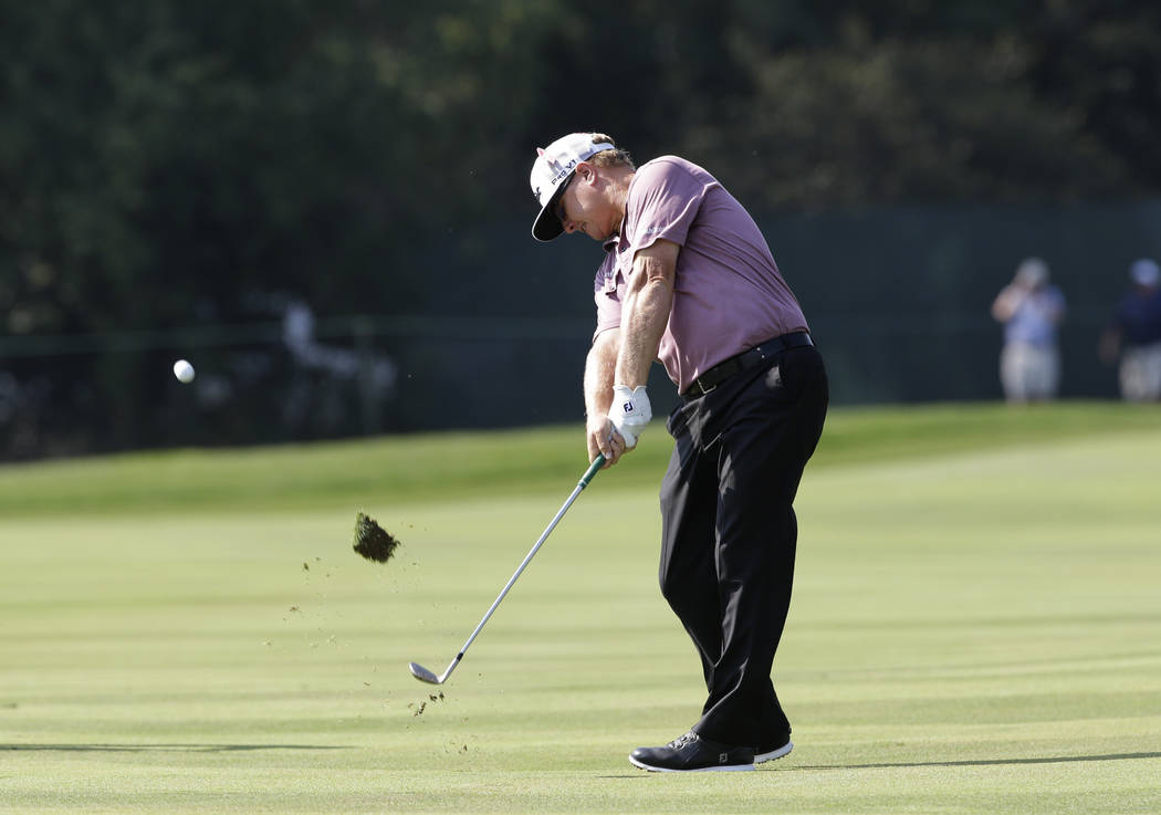Charley Hoffman hits his second shot on the third hole during the second round of the BMW Championship golf tournament at Conway Farms Golf Club, Friday, Sept. 15, 2017, in Lake Forest, Ill. (AP P ...