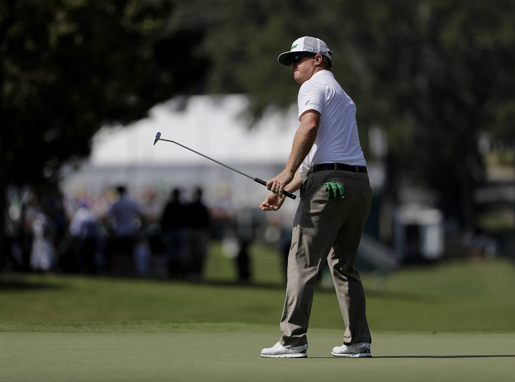 Charley Hoffman putts on the first hole during the first round of the Tour Championship golf tournament at East Lake Golf Club in Atlanta, Thursday, Sept. 21, 2017. (AP Photo/David Goldman)