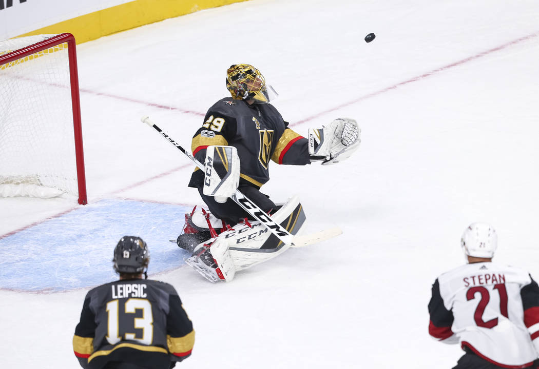 Vegas Golden Knights goalie Marc-Andre Fleury (29) makes a save during the first period of an NHL hockey game between the Vegas Golden Knights and the Arizona Coyotes, Tuesday, Oct. 10, 2017, at t ...
