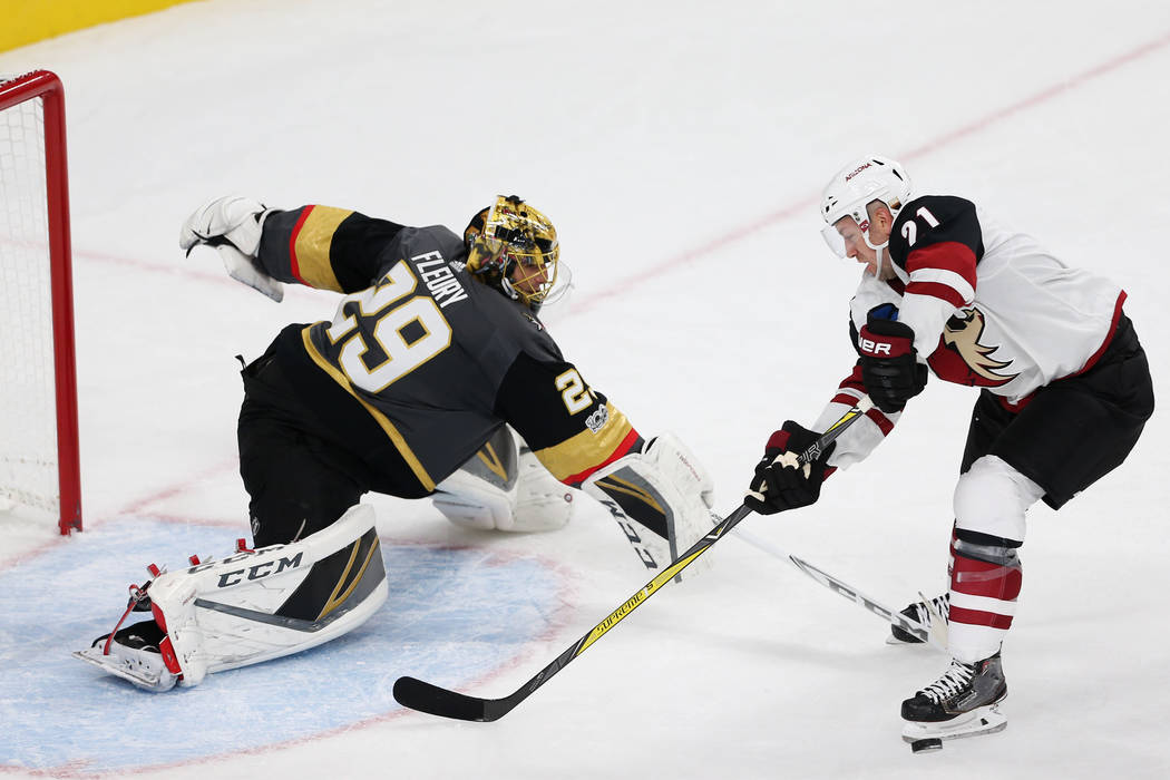 Vegas Golden Knights goalie Marc-Andre Fleury (29) makes a stop in the NHL season home opener against Arizona Coyotes center Derek Stepan (21) at T-Mobile Arena in Las Vegas, Tuesday, Oct. 10, 201 ...