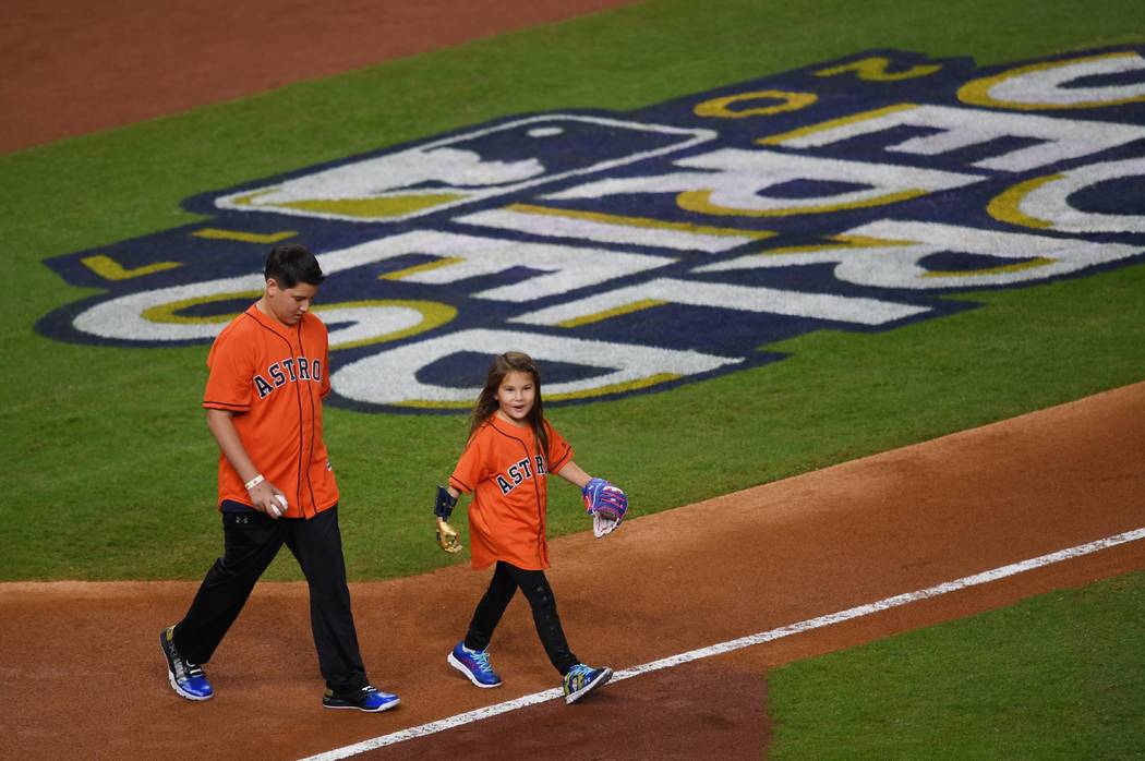 Oct 28, 2017; Houston, TX, USA; Hailey Dawson comes out for the ceremonial first pitch before game four of the 2017 World Series between the Houston Astros and the Los Angeles Dodgers at Minute Ma ...
