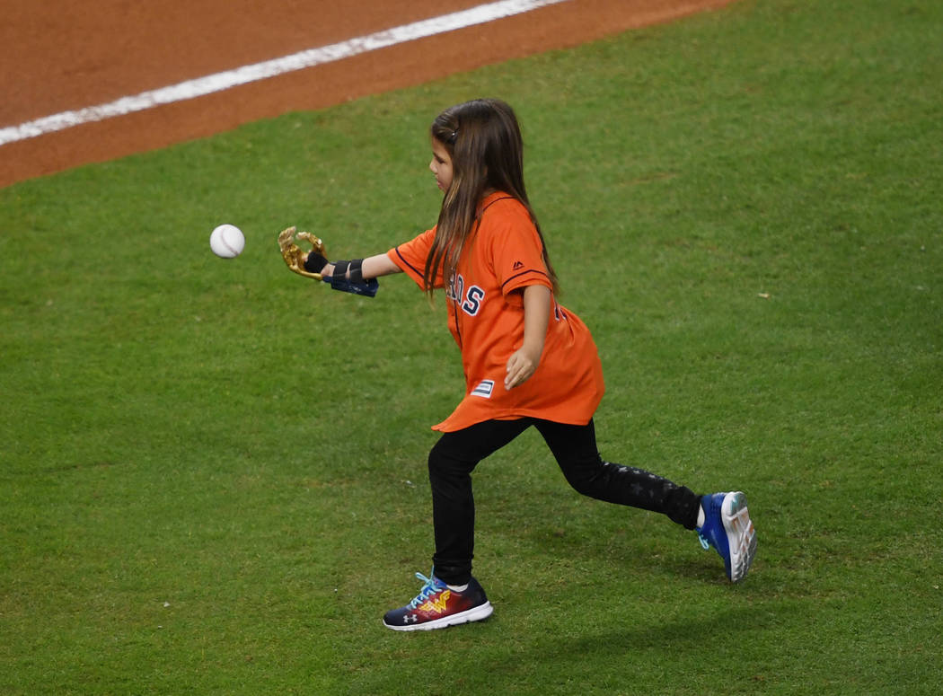 Oct 28, 2017; Houston, TX, USA; Hailey Dawson throws out the ceremonial first pitch before game four of the 2017 World Series between the Houston Astros and the Los Angeles Dodgers at Minute Maid ...