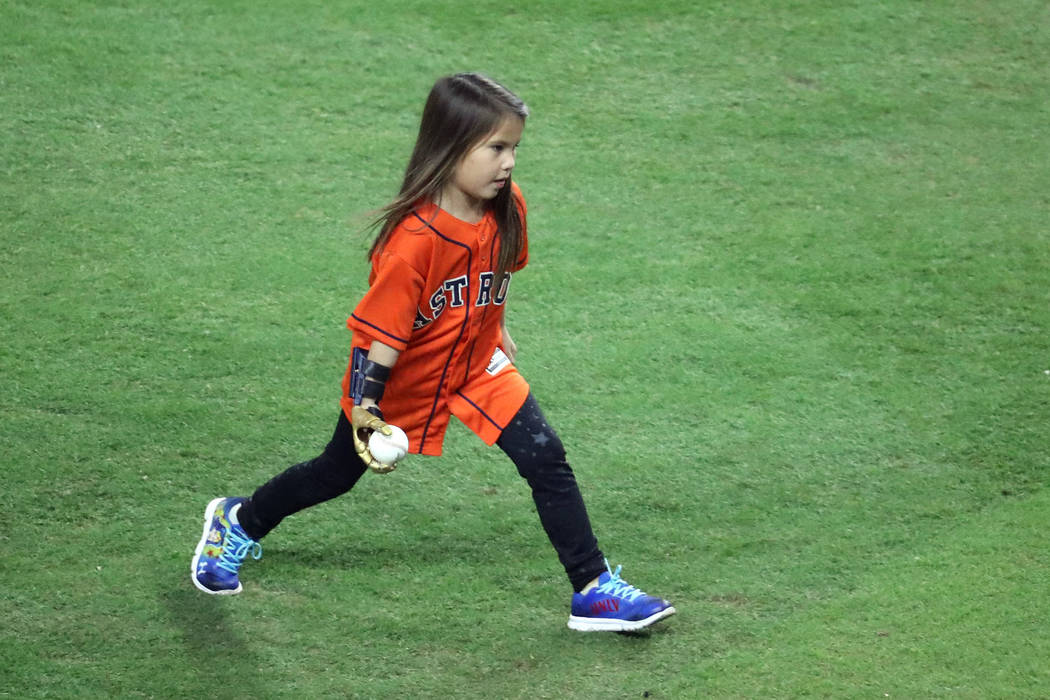 Oct 28, 2017; Houston, TX, USA; Hailey Dawson throws out the ceremonial first pitch before game four of the 2017 World Series between the Houston Astros and the Los Angeles Dodgers at Minute Maid ...
