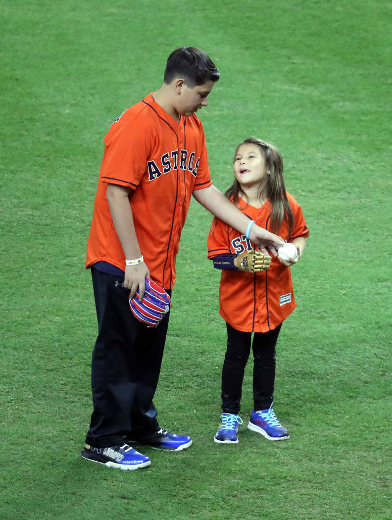 Oct 28, 2017; Houston, TX, USA; Hailey Dawson prepares to throw out the ceremonial first pitch before game four of the 2017 World Series between the Houston Astros and the Los Angeles Dodgers at M ...