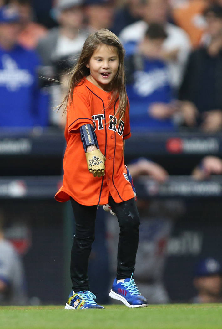 Oct 28, 2017; Houston, TX, USA; Hailey Dawson prepares to throw out the ceremonial first pitch before game four of the 2017 World Series between the Houston Astros and the Los Angeles Dodgers at M ...