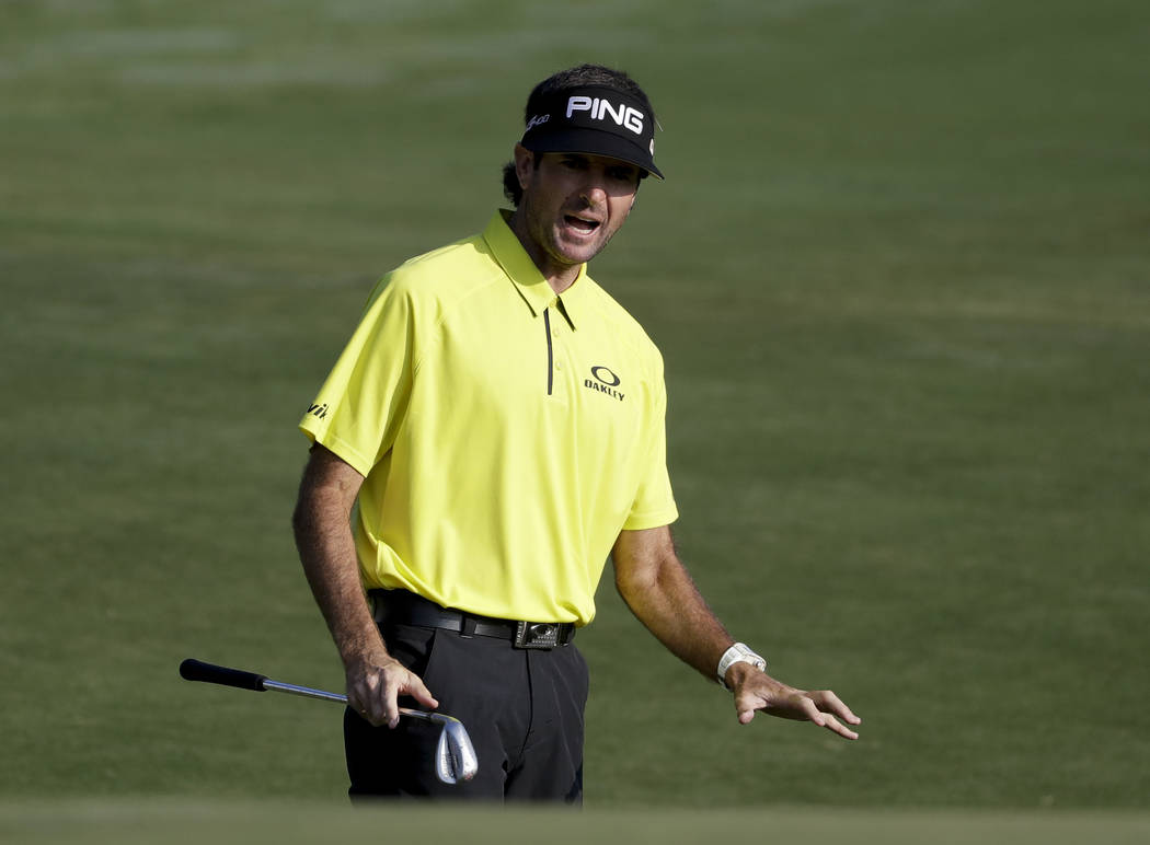Bubba Watson reacts to his chip on the 10th hole during the first round of the PGA Championship golf tournament at the Quail Hollow Club Thursday, Aug. 10, 2017, in Charlotte, N.C. (AP Photo/Chris ...