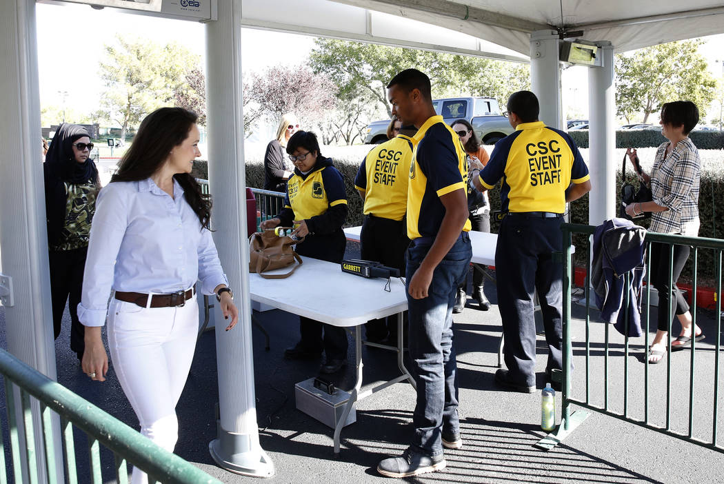 Fans walk-through metal detectors to watch as players practice for the Shrine Hospitals for Children Open golf tournament at TPC Summerlin Tuesday, Oct. 31, 2017, in Las Vegas. Bizuayehu Tesfaye/L ...