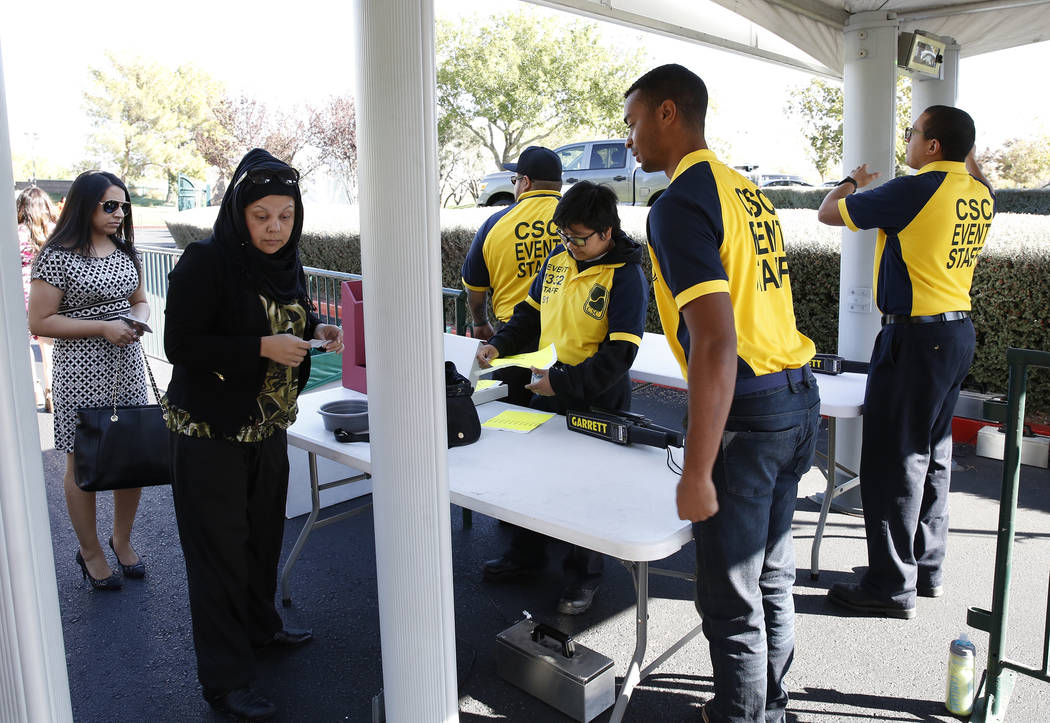 Fans walk-through metal detectors to watch as players practice for the Shrine Hospitals for Children Open golf tournament at TPC Summerlin Tuesday, Oct. 31, 2017, in Las Vegas. Bizuayehu Tesfaye/L ...