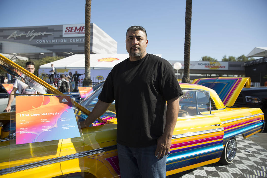 Luis Lemus and his 1964 Chevrolet Impala on display at the Las Vegas Convention Center Tuesday, Oct. 31, 2017, as part of the four-day Specialty Equipment Market Association (SEMA) show, in Las Ve ...