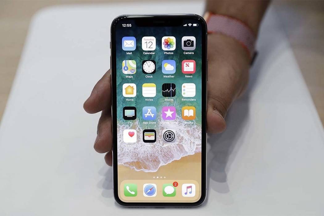 FILE - In this Tuesday, Sept. 12, 2017, file photo, the new iPhone X is displayed in the showroom after the new product announcement at the Steve Jobs Theater on the new Apple campus in Cupertino, ...