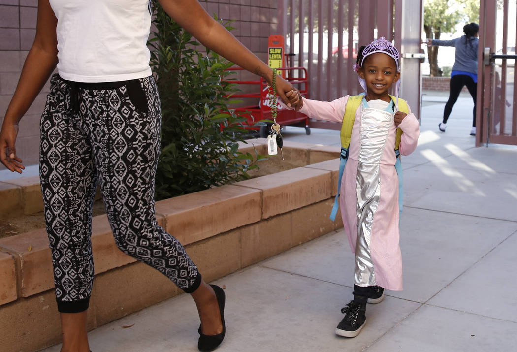 Sariah Thomas, 4, dressed like a princess arrives with her mother Candace at Mabel Hoggard Elementary School on Tuesday, Oct. 31, 2017. Bizuayehu Tesfaye/Las Vegas Review-Journal @bizutesfaye