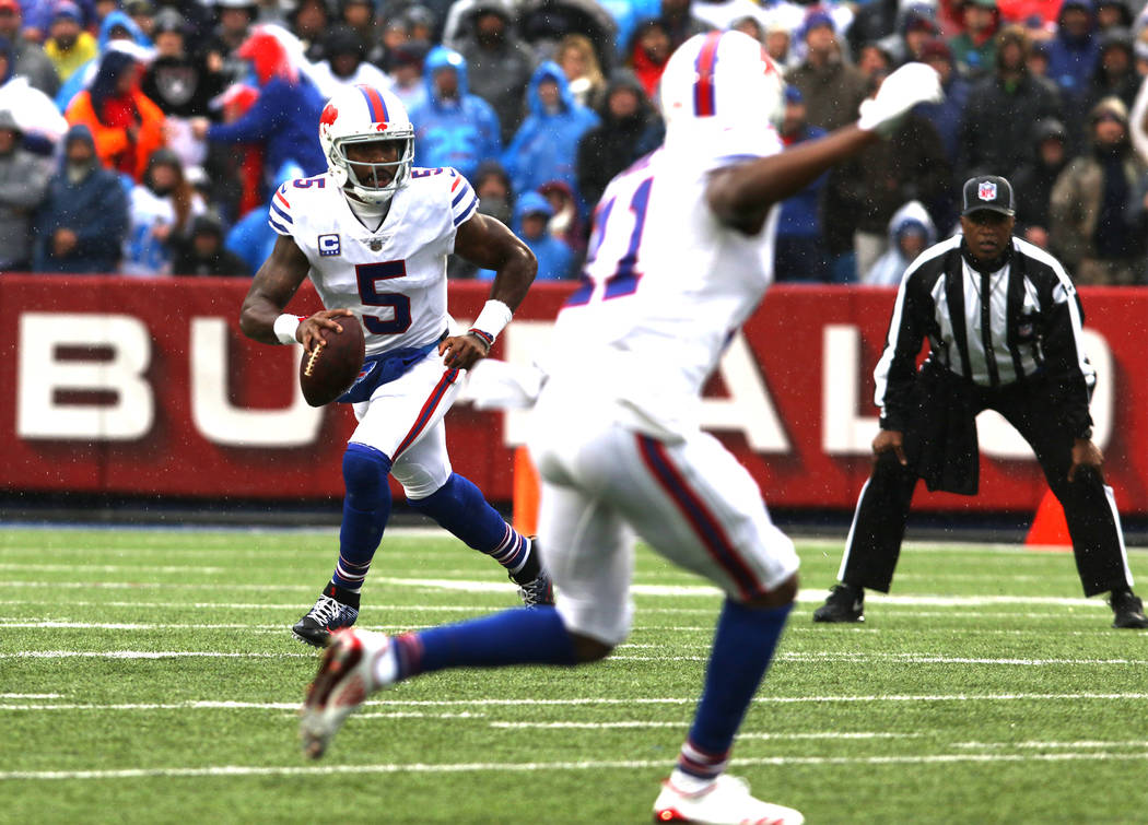 Buffalo Bills quarterback Tyrod Taylor (5) scrambles with the football against the Oakland Raiders during the first half of the NFL game in Orchard Park, New York, Sunday, Oct. 29, 2017. Heidi Fan ...