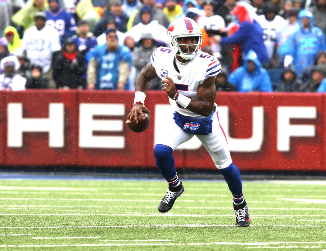 Buffalo Bills quarterback Tyrod Taylor (5) scrambles with the football against the Oakland Raiders during the first half of the NFL game in Orchard Park, New York, Sunday, Oct. 29, 2017. Heidi Fan ...