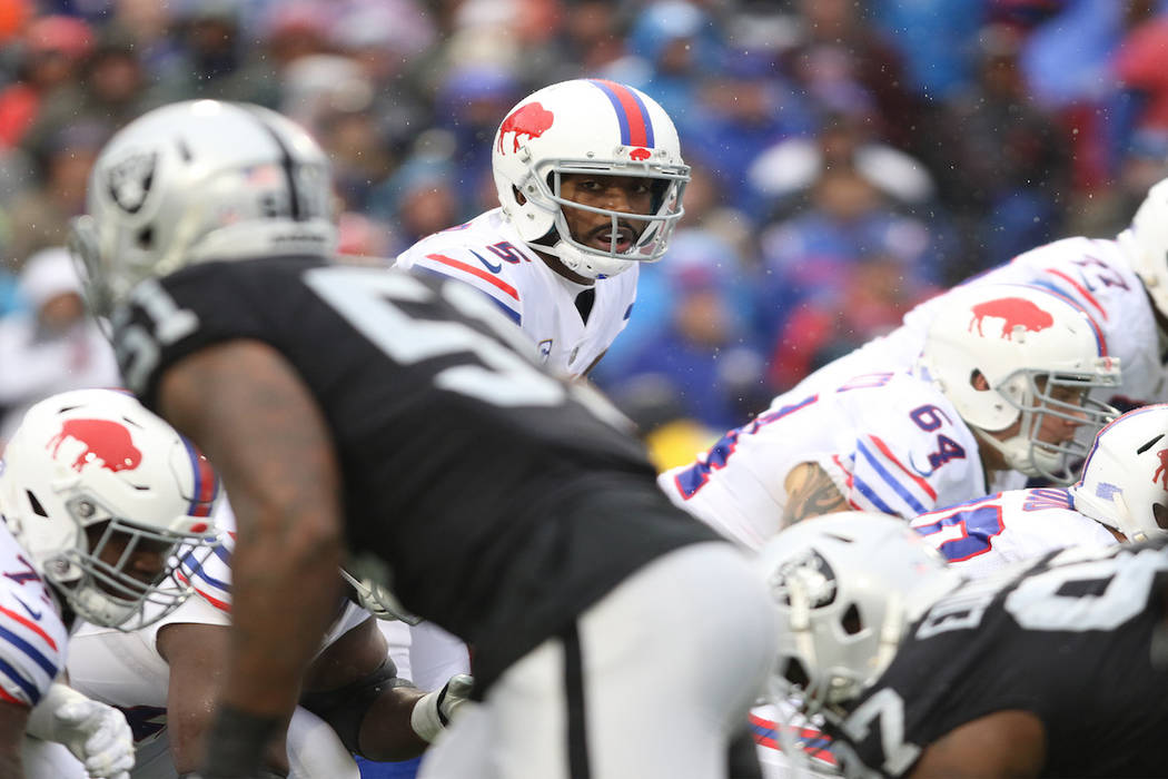 Buffalo Bills quarterback Tyrod Taylor (5) at the line of scrimmage during the first half of the NFL game against the Oakland Raiders in Orchard Park, New York, Sunday, Oct. 29, 2017. Heidi Fang L ...