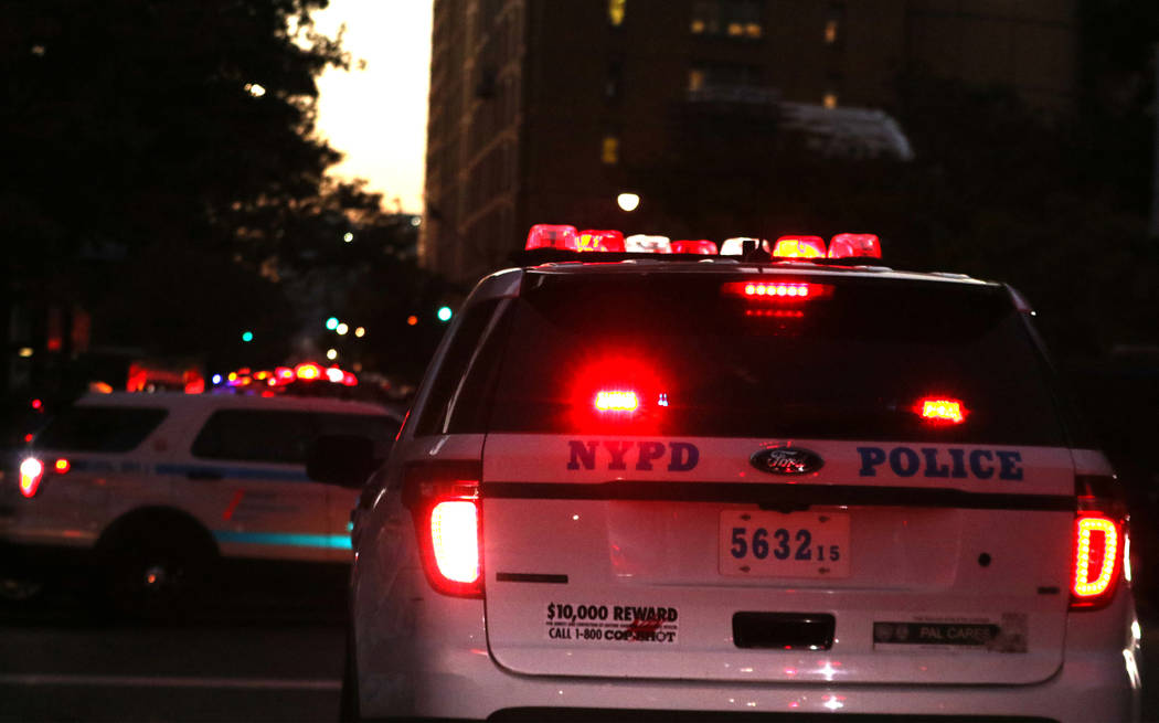 A New York Police Department vehicle on Chambers Street in lower Manhattan after a man in a rented pickup truck mowed down pedestrians and cyclists along a busy bike path near the World Trade Cent ...