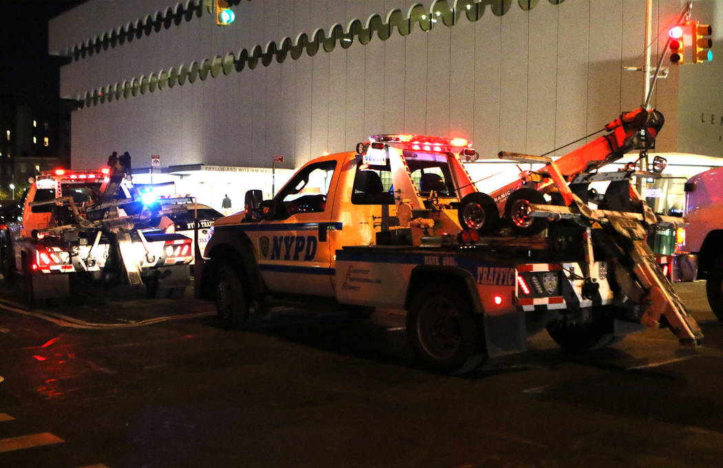 New York Police Department vehicles barricade West 13th Street and 7th Avenue in Manhattan's Greenwich Village during the Halloween parade after a man in a rented pickup truck mowed down pedestria ...