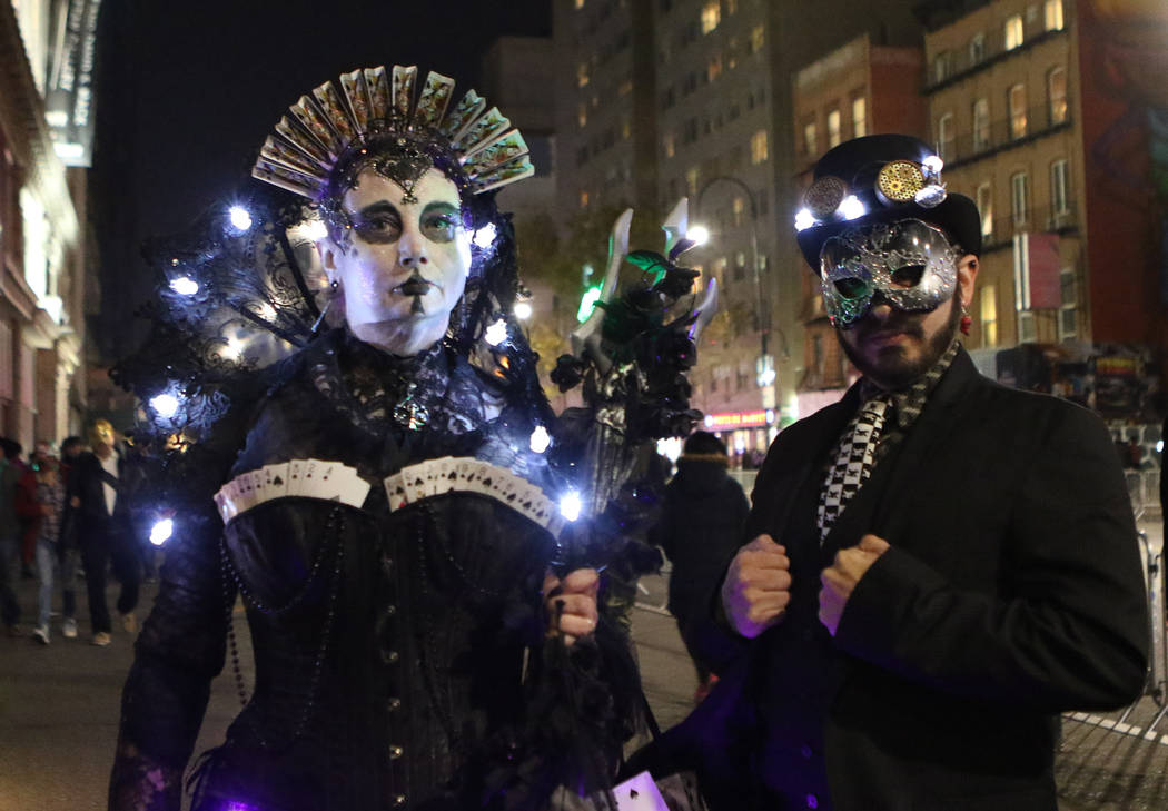 Tina Phillips of Australia, left, and Casper Snyder from New York attend the Halloween parade in Greenwich Village Manhattan on the same day a man in a rented pickup truck mowed down pedestrians a ...