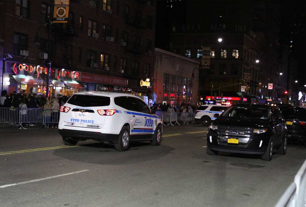 New York Police Department vehicles barricade West 14th Street near 6th Avenue in Manhattan's Greenwich Village during the Halloween parade after a man in a rented pickup truck mowed down pedestri ...
