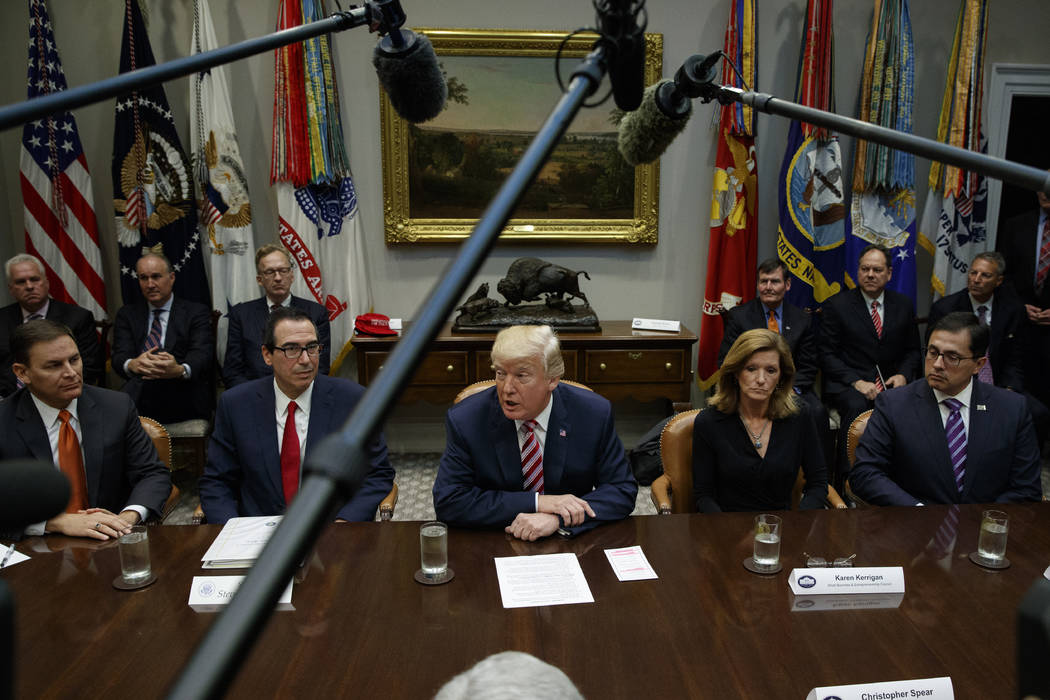 President Donald Trump speaks during a meeting on tax policy with business leaders in the Roosevelt Room of the White House, Tuesday, Oct. 31, 2017, in Washington. From left, Jay Timmons, Presiden ...