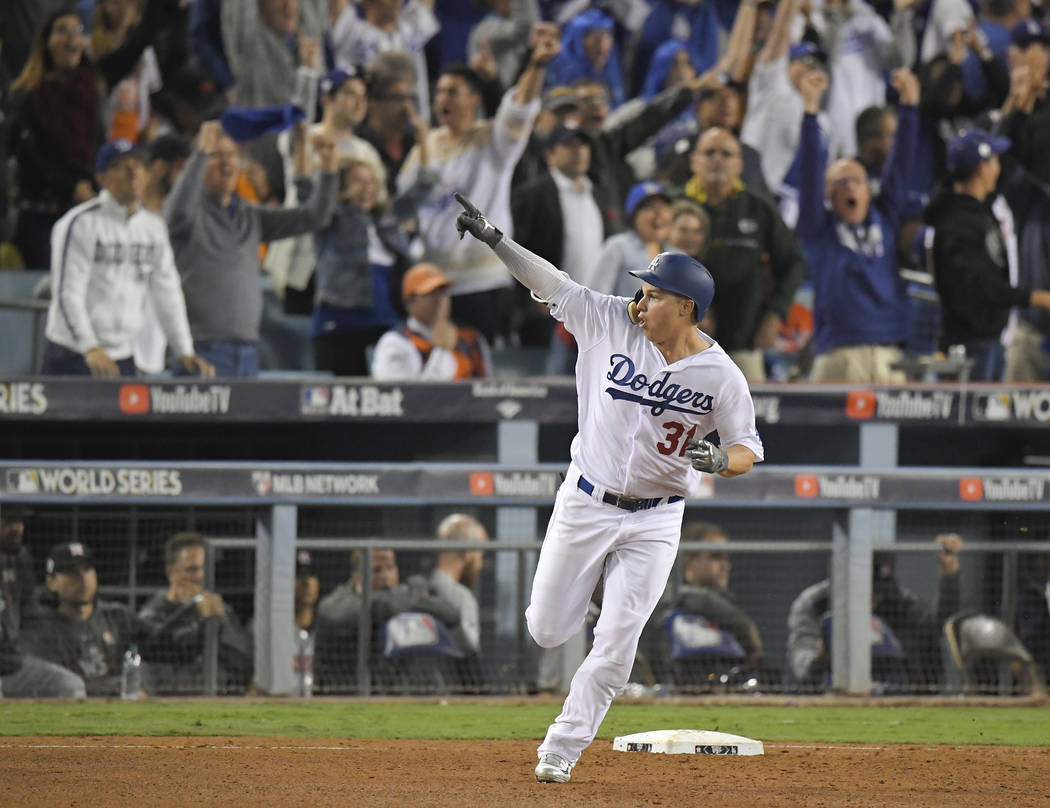Los Angeles Dodgers' Joc Pederson celebrates his home run off against the Houston Astros during the seventh inning of Game 6 of baseball's World Series Tuesday, Oct. 31, 2017, in Los Angeles. (AP ...